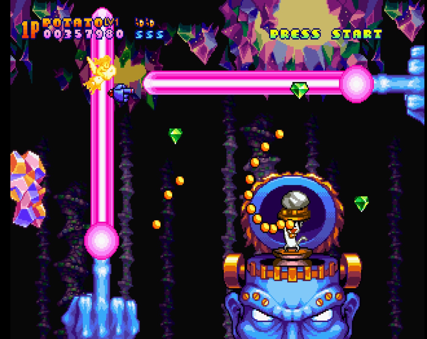 A blue golem boss firing pink energy whips in a crystal cavern.